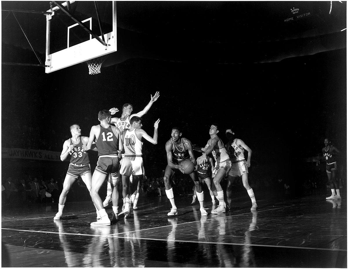 North Carolina triple-teams Wilt Chamberlain.