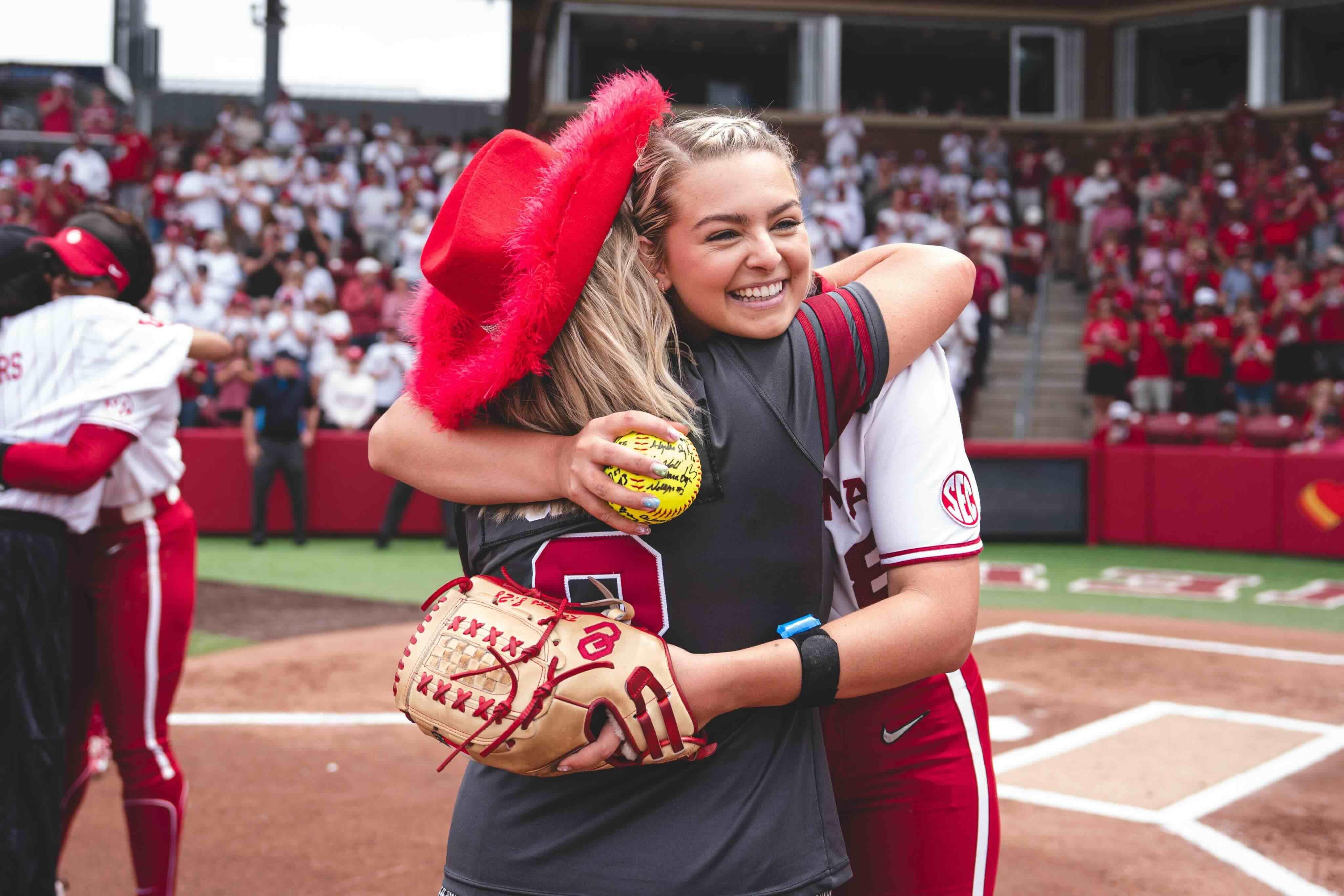 Oklahoma pitcher Isabella Smith hugs her mom on senior day