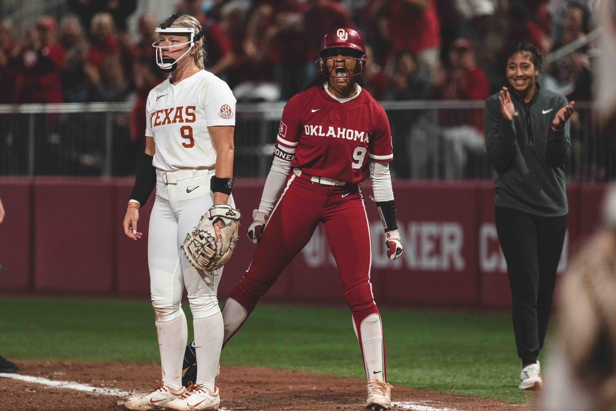 Oklahoma's Tia Milloy celebrates on first base against Texas