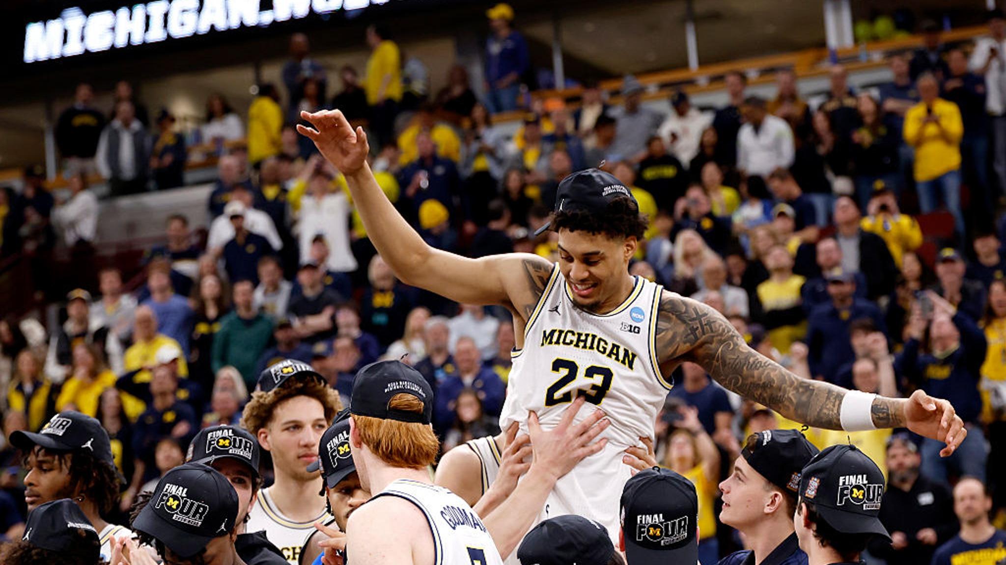 Yaxel celebrates with Michigan