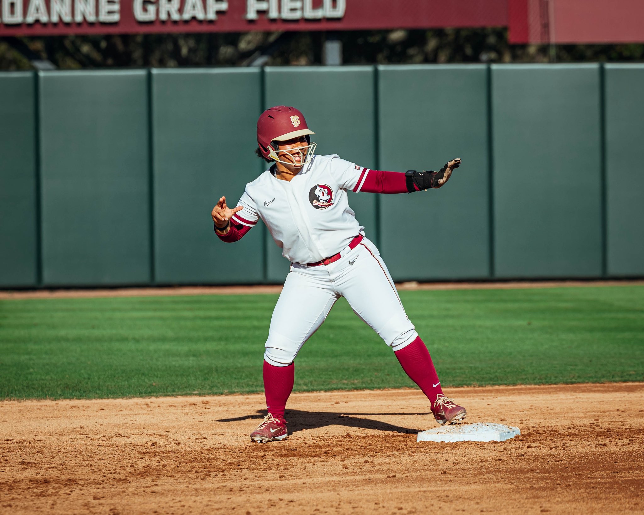 Florida State softball player celebrates after double