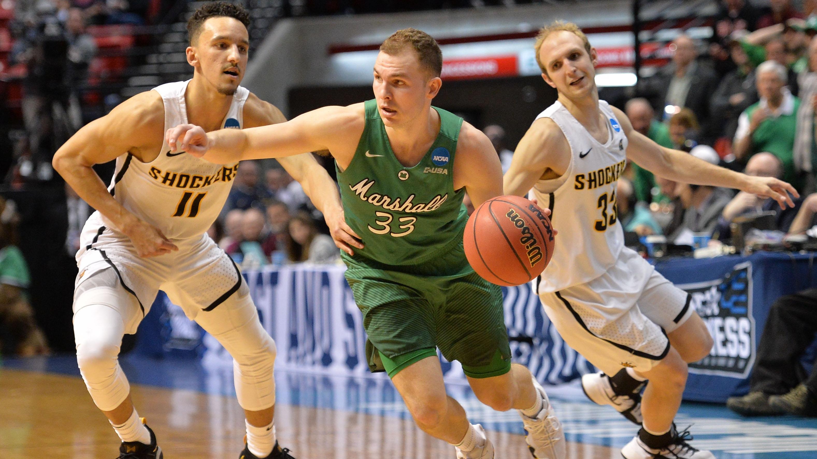 Marshall's Jon Elmore drives to the rim