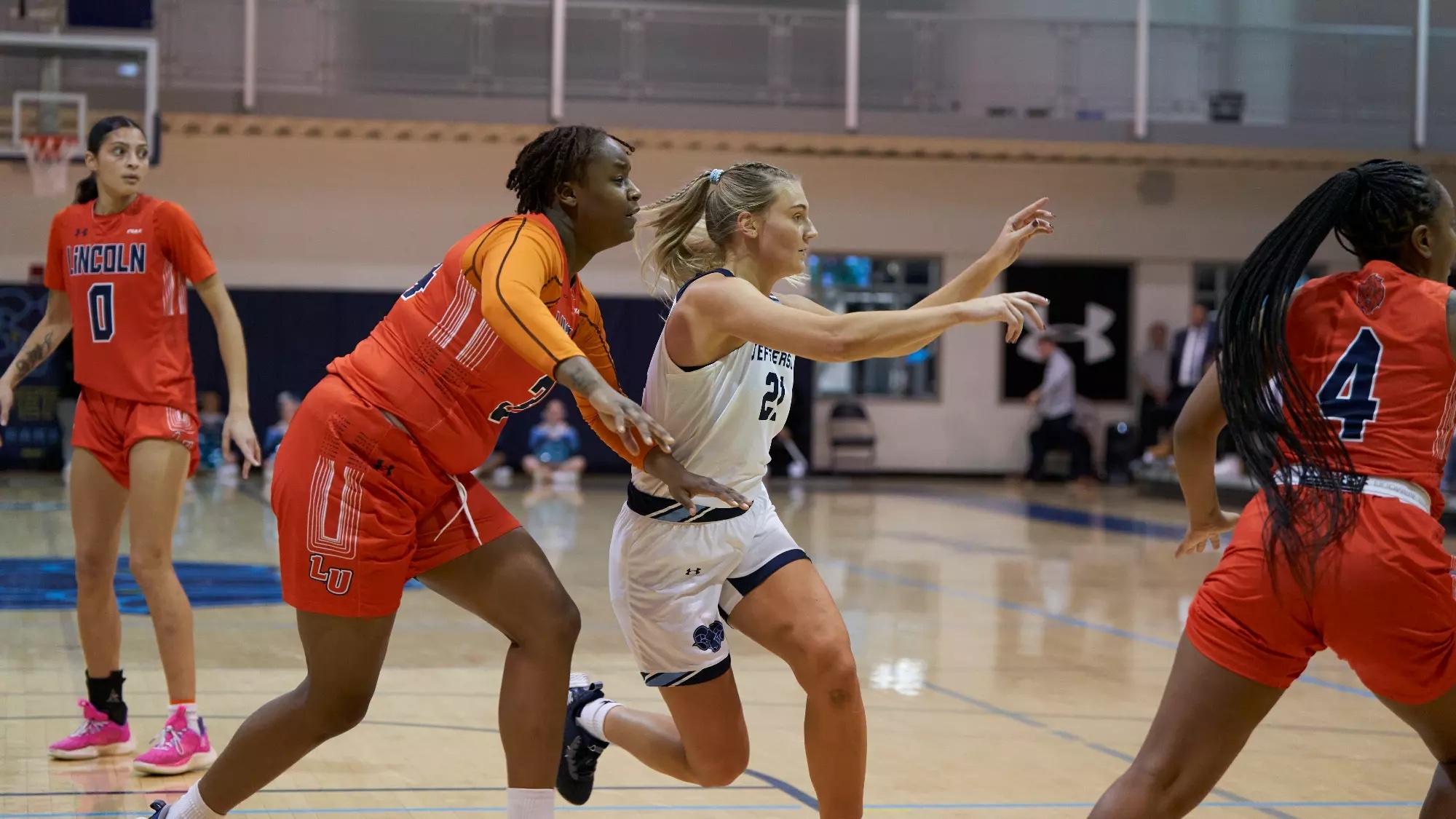 Sam Yencha goes to the basket for the Jefferson Rams.